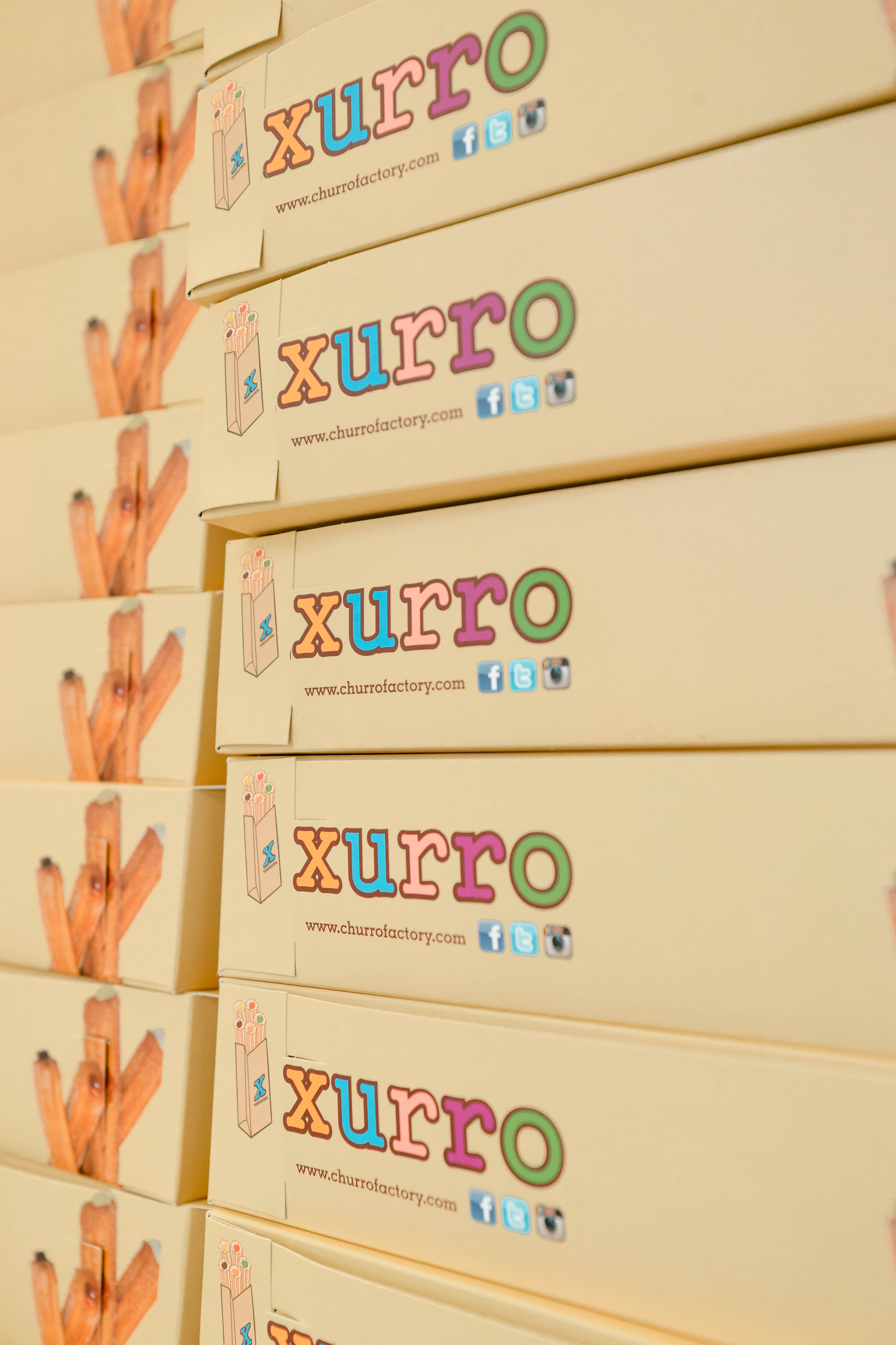 Xurro to-go churro boxes stacked